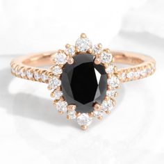 a black and white diamond ring on a white surface