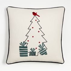 a white pillow with a christmas tree on it