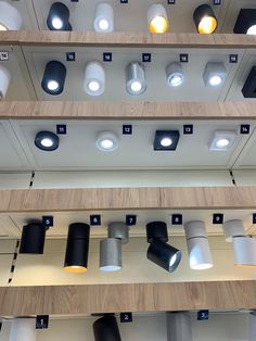 several different types of lights hanging from the ceiling