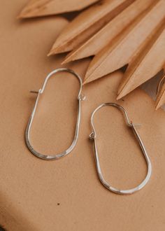 These hoops have just the right amount of movement thanks to the perfect amount of hammered texture and the swing latch design. Measures 2" long by 1" wide. Hoop hinge is made of 18g wire. Sold as a pair. Available in 14kt Gold Fill + Sterling Silver. Paired with our best-selling earring, the Tiny Twist Earrings. Handmade in Eau Claire, WI. Our jewelry is handmade so each piece will be unique and may vary slightly from what is pictured. Soldering Projects, Cold Connections, Twist Earrings, Adornment Jewelry, Everyday Wear Jewelry, Hammered Jewelry, Metal Smithing, Jewelry Design Inspiration, Ear Candy