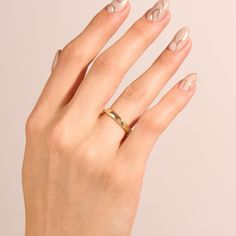 Celebrate the eternal bond of love with our Minimalist Flat Wedding Band. This ring embodies timeless simplicity and elegance. The slender, flat band design in lustrous gold offers a classic and refined look that pairs seamlessly with any engagement ring. Its understated beauty allows it to symbolize the everlasting commitment shared between two souls. - Made in 14k solid gold - Band Width: 2 mm / 0.08 inches - Thickness: 1.2 mm / 0.05 inches - This product comes with an iconic Norm Jewels gift Flat Wedding Band, Gold Knot Ring, Timeless Simplicity, Minimalist Flat, Curve Ring, Crescent Necklace, Pear Ring, Solid Gold Band, Band Design