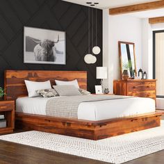 a bedroom with black walls and wooden furniture