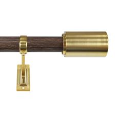 a brass curtain rod with a wooden handle and metal fittings on the end, against a white background