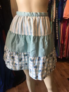 "Vintage petite Bobbie Brooks tiered spring skirt. Excellent condition. Measurements: 24\" waist 48\" hip 18\" length" Blue Tiered Skirt For Spring, Tiered Ruffle Skort, Tiered Blue Skirt With Ruffles, Cotton Tiered Skirt With Layered Hem, Tiered Ruffle Cotton Skort, Blue Lined Tiered Skirt, Tiered Skirt With Ruffle Hem, Blue Tiered Lined Skirt, Blue Tiered Skirt With Lining