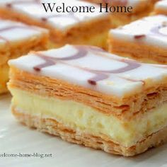 several pieces of cake sitting on top of a white plate with the words welcome home