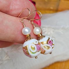 Pair of Murano glass bead earrings in colors of white, pink and gold. Accenting these gorgeous beads are freshwater pearls and small gold filled beads. The Venetian glass bead is made by hand on the island of Murano by master glass makers, as they have done for hundreds of years. All wire wrapped and finished with gold-filled ear wires. These earrings represent timeless beauty. Price: $30.00 Earring Length: 1 1/2 inches long from the top of the ear wire to the bottom of the earring Your earrings Glass Bead Earrings, The Venetian, Murano Glass Beads, Venetian Glass, Bead Earrings, Etsy Jewelry, Ear Wire, Glass Bead, Murano Glass