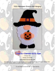 a crocheted halloween gnome with a pumpkin on it's head and black hat