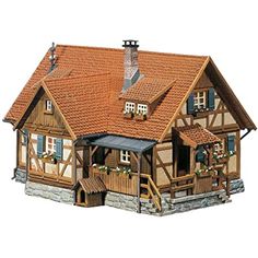 a wooden house with two balconies on the roof