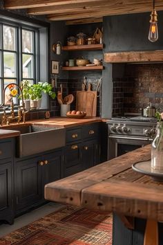 a kitchen with black cabinets and wooden counter tops is pictured in this image, there are potted plants on the window sill