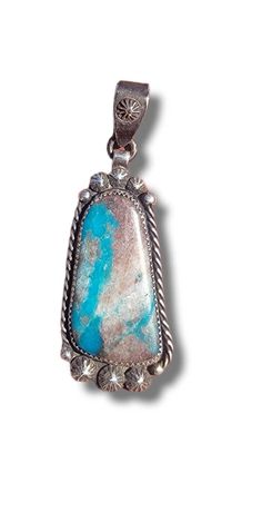 Here is a beautiful bisbee ribbon pendant with a quarts matrix with jasper, this particular material is nearly impossible to find as most if not all of it has been mined out The setting is antiqued handmade silver and is a true gem for the turquoise lover in your life! Collectible Turquoise Necklace With Natural Stones, Turquoise Pendant Necklace With Patina, Sterling Silver Pendant Jewelry With Patina, Untreated Turquoise Pendant Necklace Collectible, Untreated Turquoise Pendant Necklace For Collectors, Unique Untreated Turquoise Pendant Necklace, Collectible Turquoise Gemstone Pendant Necklace, Bisbee Turquoise, American Jewelry