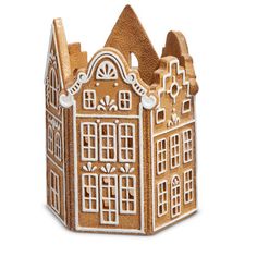 a gingerbread house shaped cookie on a white background