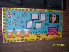 a bulletin board with pictures and writing on it