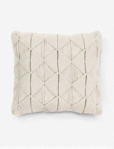 a knitted pillow on a white background