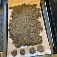 an uncooked cookie is sitting on top of a baking sheet in the oven