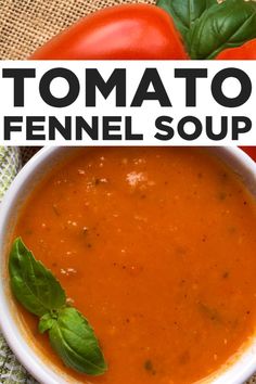 tomato and fennel soup in a white bowl with basil leaves on the table next to tomatoes