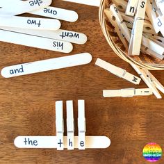 several pieces of clothes pins with the words on them and numbers in front of them