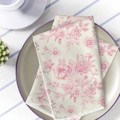 two napkins sitting on top of a plate