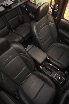 the interior of a vehicle with black leather seats