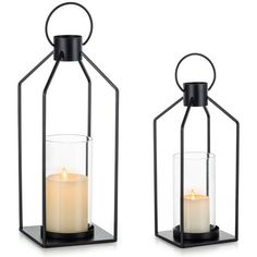 two black metal lanterns with candles in them on a white background, one is open and the other has a lit candle inside