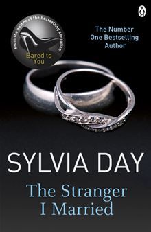 a book cover with two wedding rings on top of each other and the title, the strange