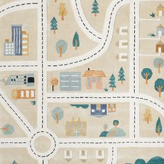 a child's rug with a road and houses on the map in pastel colors