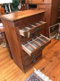 an old wooden dresser with many drawers