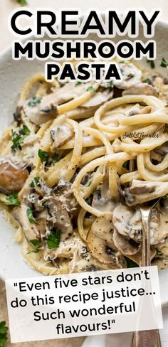 a white plate topped with pasta covered in mushrooms