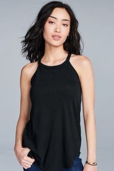 This Rocker tank is crafted with a high neckline and a super soft, Tri-Blend fabric composed of 50% polyester, 25% combed ring-spun cotton and 25% rayon. Great for DIY projects or to wear blank. Super soft Tri-Blend Rocker tanks! -High Neck Line -4.5-ounce, 50/25/25 poly/combed ring-spun cotton/rayon Sporty Halter Tank Top For Workout, Racerback Workout Tops, Casual Black Racerback Halter Top, Casual Stretch T-back Top, Casual Sleeveless Sports Halter Top, Casual Halter Neck Tank Top For Yoga, Casual Halter Neck Sports Top, Black Racerback Halter Top For Workout, Racerback Halter Top For Yoga