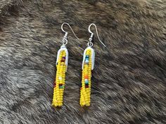 "Authentic Beautiful Native America Navajo Hand Beaded \"Healing Corn\" Earrings with Leather Husks. Hand Beaded by Navajo Artist ❤️ In common with many other Southwestern indigenous groups, corn is seen as the primary food for the Navajo (also known as the Diné). It is considered the mother, enabler, transformer and healer. Corn pollen is a crucial element in Navajo healing rituals, and is often carried by elder generations in a pouch worn around the neck for ceremonial use. To bless oneself or Southwestern Beaded Dangle Earrings, Southwestern Beaded Fringe Dangle Earrings, Southwestern Style Beaded Dangle Earrings, Southwestern Style Beaded Fringe Dangle Earrings, Southwestern Beaded Fringe Earrings For Gift, Southwestern Beaded Fringe Dangle Jewelry, Southwestern Style Beaded Fringe Dangle Jewelry, Southwestern Style Dangle Jewelry With Beaded Fringe, Easy Earrings