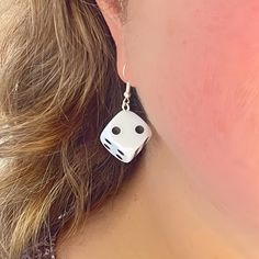 Perfect for gamers and fashion enthusiasts alike!  Our eye-catching Dangle Dice Earrings are crafted from standard-sized white dice, these earrings blend playful charm with a bold statement. Each earring features a single die, showcasing the classic dot design, adding a fun and quirky twist to your accessory collection. The dice drop length is 4 cm and they are securely attached to high-quality metal hooks, ensuring durability and comfort for all-day wear. Whether you're heading to a game night, a casual outing, or looking to add a personality to your everyday style, these earrings will turn heads and spark conversations. Add a roll of the dice to your look with our Dangle Dice Earrings - where fashion meets fun! Card Game Earrings, Adjustable Novelty Single Earring Jewelry, White Personalized Novelty Jewelry, Personalized White Novelty Jewelry, Novelty Personalized White Jewelry, White Novelty Dangle Jewelry, White Sterling Silver Novelty Jewelry, Novelty White Dangle Jewelry, Novelty White Sterling Silver Jewelry