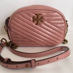 100% Authentic Brand New Never Used Item , It Came With Store Tags) Tory Burch Kira Small Chevron Camera Bag Color:Pink Magnolia/Dark Gold Msrp:$398 Details: Adjustable Crossbody Strap, 22.5" Drop Dimensions: 7.2"W X 2.4"D X 5"H Zip Closure Interior Zip Pocket & Two Slip Pockets Signature Gold-Tone Hardware Model Measurements: 5'10" Height, Wearing A Size 4 Or Small Nylon & Polyurethane Lining Body: Leather; Coating: Nil Imported Dust Bag Included Comes From Smoke-Free, Pet-Free, And Dust-Free E Tory Burch Kira Chevron Camera Bag, Kira Chevron, Pink Magnolia, Quilted Top, Tory Burch Kira, Tory Burch Handbags, Designer Crossbody Bags, Tory Burch Bag, Dark Gold