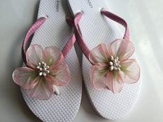 These beautiful white flip flops are hand wrapped in mauve satin ribbon, and adorned with a  handmade two tone organza flower with pearl pistils. Ribbon color is mauve, if you are needing other colors of ribbon or decoration please contact me and will be happy to accommodate you! All flip flops are handmade to order and the production time is 5-7 business days and then please allow additional time for shipping. Amazing for beach, weddings, flower girl or a fancy event, you choose! Please choose White Sandals As Spring Gift, White Sandals For Spring Gift, White Summer Flip Flops As Gift, White Summer Flip Flops For Party, White Summer Party Flip Flops, White Flip Flops As Summer Gift, White Sandals For Beach Wedding In Spring, Adjustable White Flip Flops For Beach Season, White Flip Flops For Beach Season Parties