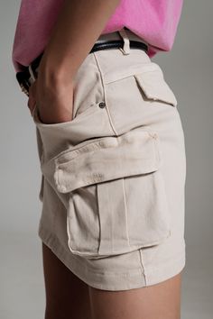 Cargo Mini Skirt in Beige - Szua Store Cotton Cargo Shorts With Multiple Pockets For Workwear, Trendy High Waist Cargo Skirt With Multiple Pockets, Trendy High-waist Cargo Skirt With Multiple Pockets, Utility Mini Bottoms With Pockets, Utility Cotton Cargo Skirt, Utility Cargo Mini Skirt With Patch Pockets, Cotton Utility Mini Skirt, Spring Cargo Shorts For Workwear With Side Pockets, Utility Style Cotton Mini Skirt