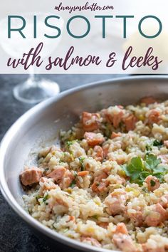 salmon risotto with parsley and herbs in a silver bowl on a table