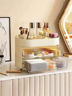 an organized makeup organizer sits on top of a dresser