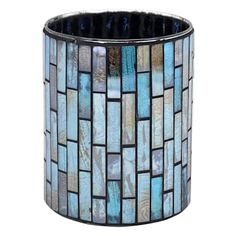 a glass vase with blue and brown tiles on it