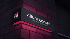 there is a sign that says allure conseii on the side of a building