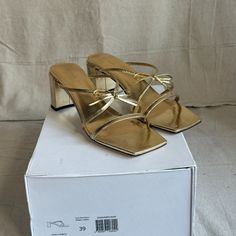 Never Worn By Far Gold Sandals. Sold Out Online (From What I Can See). Delicate And Lightweight With A Sturdy Heel. Size 39. Gold Sandals With Removable Insole For Parties, Gold Mules With Heel Strap For Spring, Luxury Sandals With Wrapped Heel And Square Toe, Chic Square Toe Sandals With Wrapped Heel, Luxury Summer Heels With Heel Loop, Chic Gold Sandals With Wrapped Heel, Gold Leather Block Heel Mules, Gold Leather Mules With Block Heel, Designer Summer Sandals With Square Toe