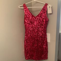 Beautiful Red Sequin Homecoming/Party Dress That Is Sure To Dazzle! Bright Red Sequins Shine Beautifully In All Light. Red V-neck Mini Dress For Holiday, Red V-neck Mini Dress For Party Season, Red Sleeveless Sequined Mini Dress, Flirty Red Sequined Mini Dress, Glamorous Red Holiday Mini Dress, Red Sequin Dress For Spring, Red Sequined Dresses For Spring, Glamorous Red Spring Dress, Glamorous Red Dress For Spring