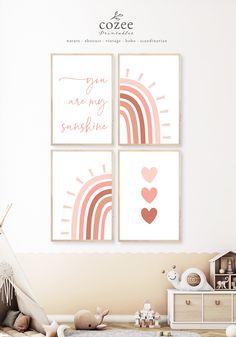 three pink and white pictures on the wall in a child's room with a teepee