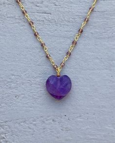 This necklace is handcrafted using a 2mm amethyst wire-wrapped chain and a 12mm faceted amethyst heart pendant. The amethyst is authentic and AAA quality. A gunmetal version is also available in my shop. Amethyst promotes peace, clarity and cleanses energy.  The necklace comes in a ribbon-wrapped box, ready to be gifted. If you would like to leave a note for the recipient, you can do so during checkout. Please note that each stone is unique and varies in color. Heart Shaped Amethyst For Jewelry Making, Heart-shaped Amethyst For Jewelry Making, Purple Amethyst Jewelry With Heart Charm, Handmade Heart-shaped Jewelry For Meditation, Spiritual Lavender Wire Wrapped Necklaces, Purple Heart Pendant Necklace For Jewelry Making, Wire Wrapped Amethyst Necklaces For Meditation, Purple Amethyst Heart Necklaces, Purple Heart-shaped Amethyst Necklaces