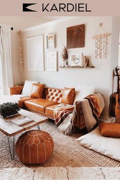 a living room filled with lots of furniture next to a fire place and a guitar on the wall