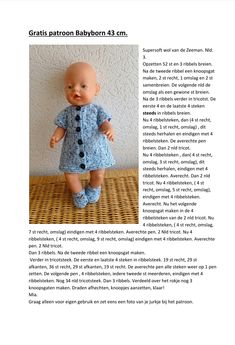 an image of a baby doll that is wearing a blue dress and black buttons on it