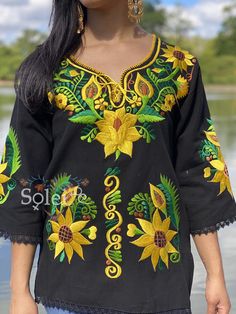 This Beautiful Mexican blouse is embroidered on an artisanal Machine using Silk Thread and it also has a hand knit neckline. It has beautiful flowers embroidered both on the front and also on the sleeves. This Blouse is truly a work of art and one of a kind. Fitted Bohemian Blouse With Embroidered Neckline, Yellow Floral Embroidery Blouse For Vacation, Fitted Bohemian Tops With Intricate Embroidery, Bohemian Fitted Tops With Intricate Embroidery, Fitted Bohemian Blouse With Multicolor Embroidery, Floral Embroidered Tunic Top For Festival, Bohemian Blouse With Embroidered Hem For Festivals, Bohemian Embroidered Fitted Top For Festivals, Bohemian Embroidered Peasant Top For Fall