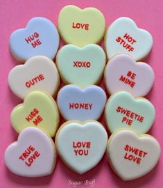 heart shaped cookies with words on them