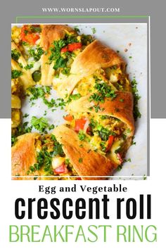 an egg and vegetable crescent roll breakfast ring on a white plate with text overlay