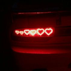 the tail light of a car with hearts on it