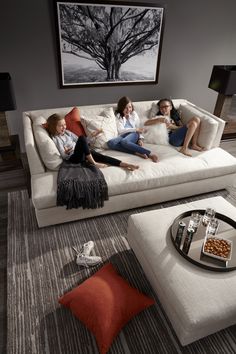 three women sitting on a couch in a living room with the caption instagram