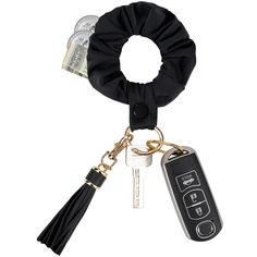 a key chain with a black ring and two keys attached to it, on a white background