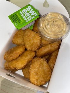 chicken nuggets with mustard and ketchup in a box